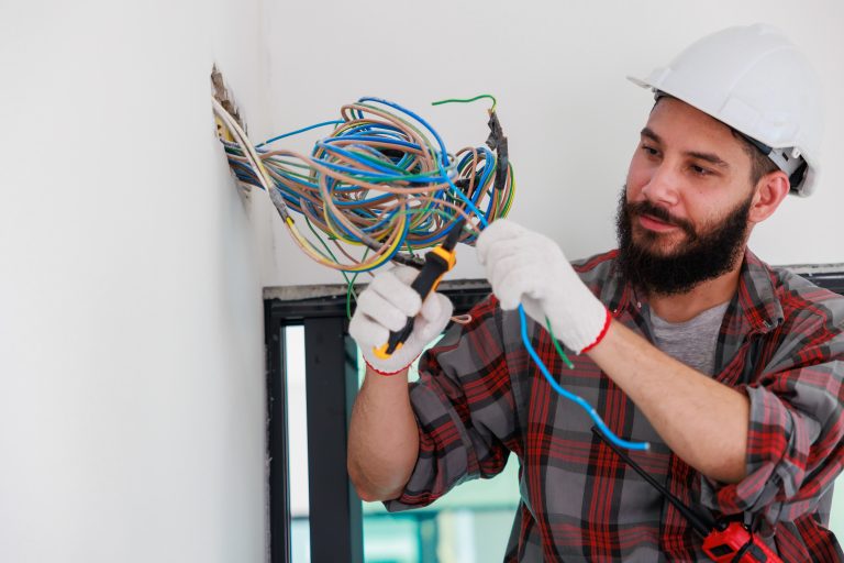 Electrical Worker Rewiring a House