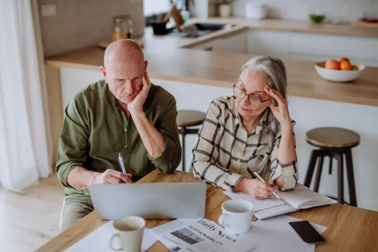 Couple looking at his bills, Generator and Utility Bill