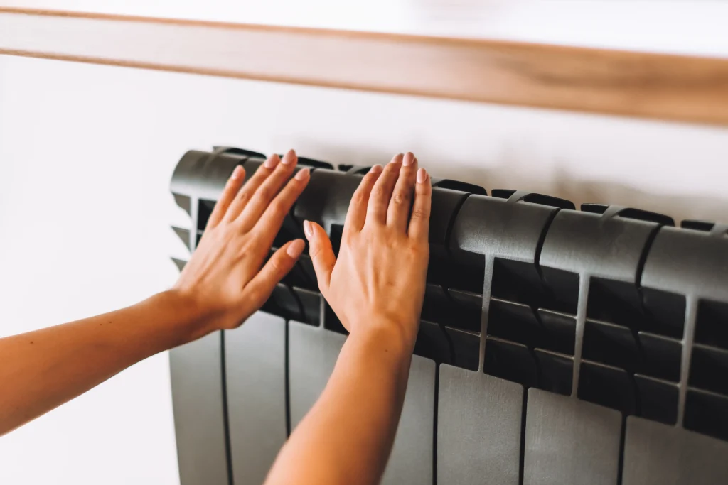 lady hands over space heater